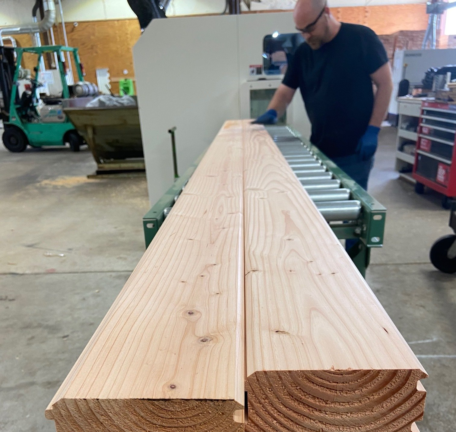 a machine cutting 2x6s into custom mouldings