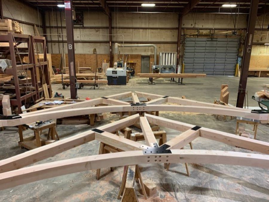 a timber truss under construction