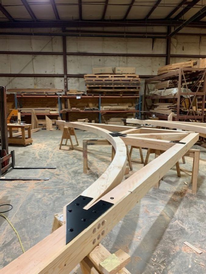 a timber truss under construction