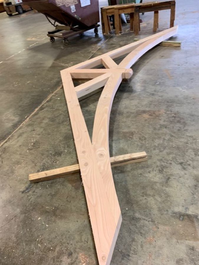 a timber truss under construction