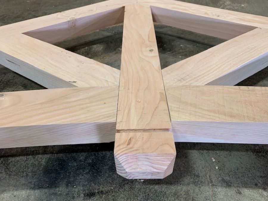 a timber truss under construction