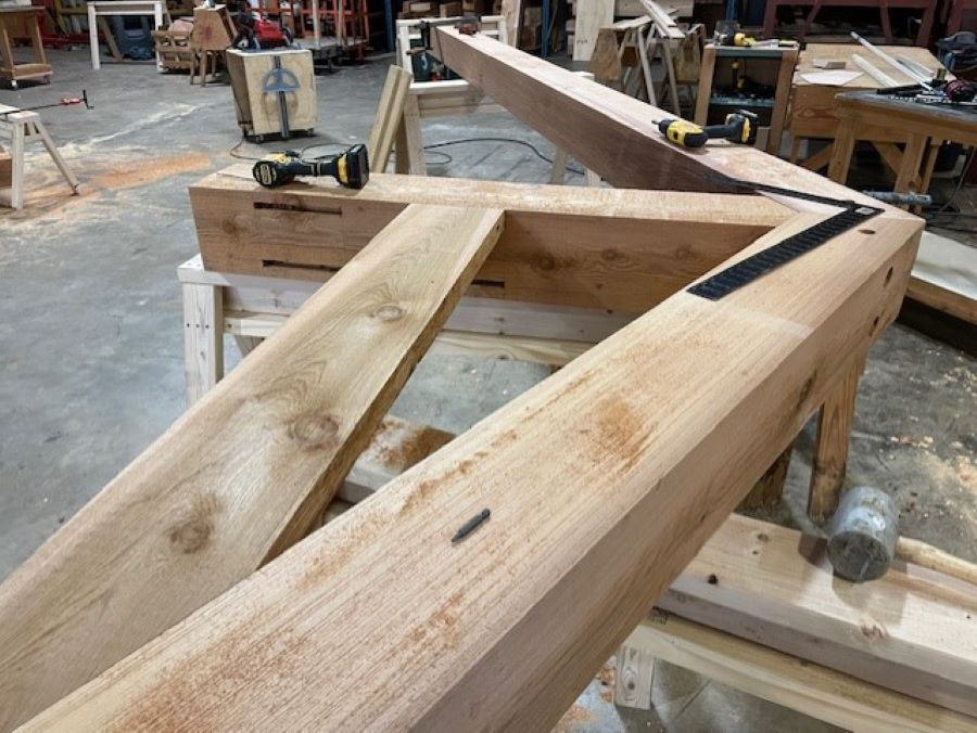 a timber truss under construction