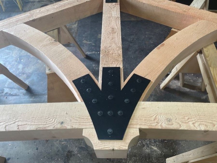 a timber truss under construction