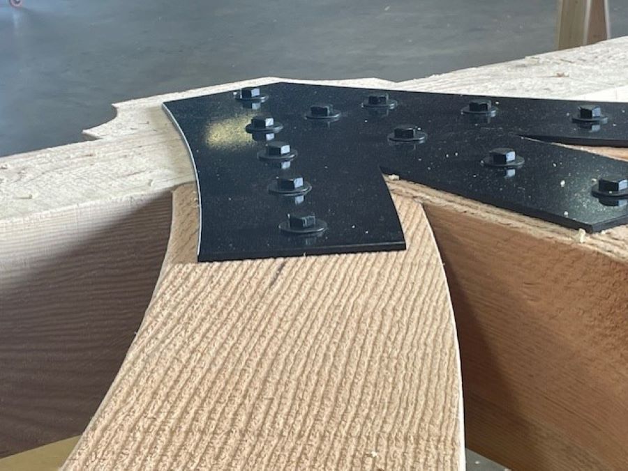 a timber truss under construction