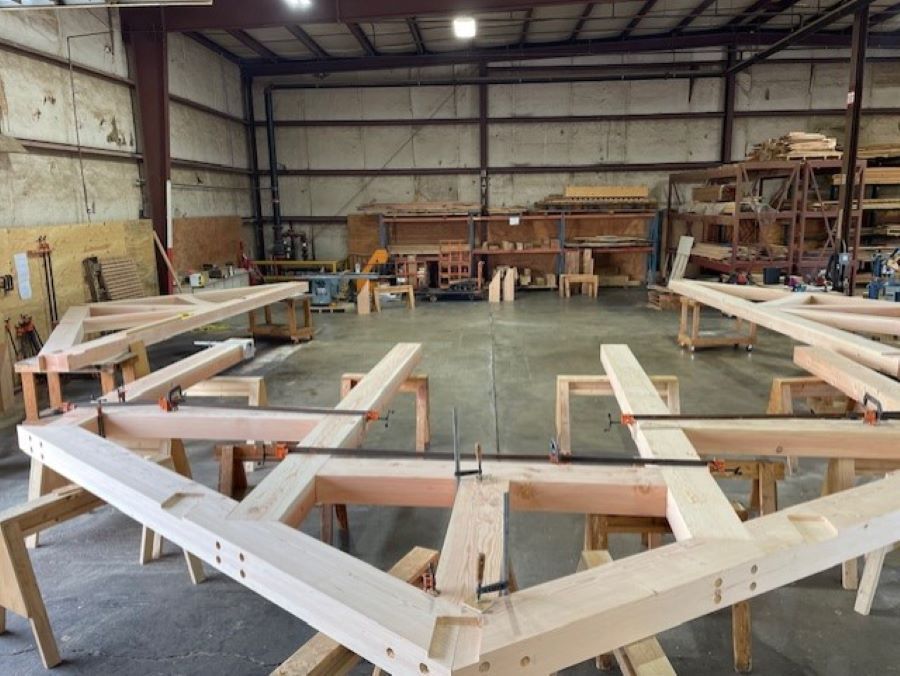 a timber truss under construction