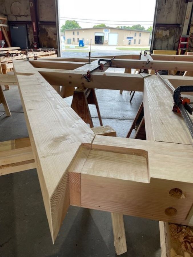 a timber truss under construction