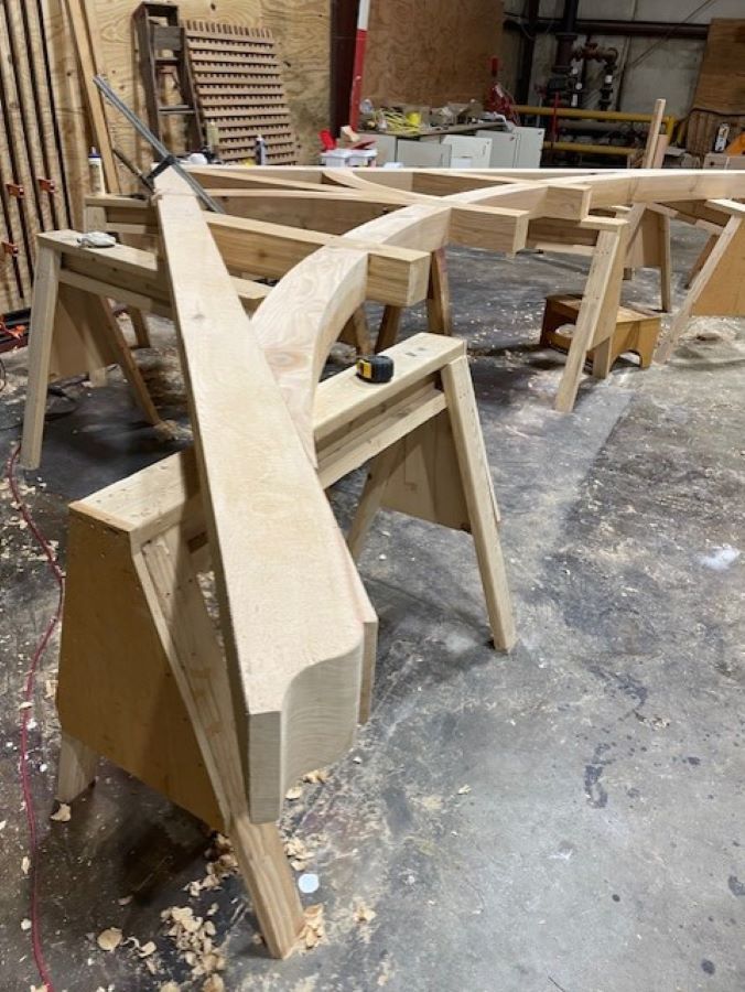 a timber truss under construction