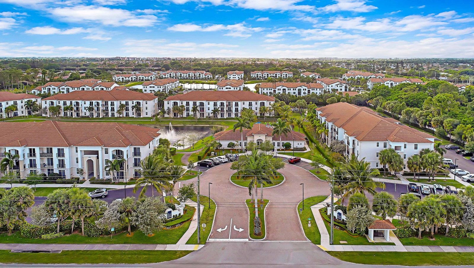 An aerial view of a residential area with lots of buildings and trees.