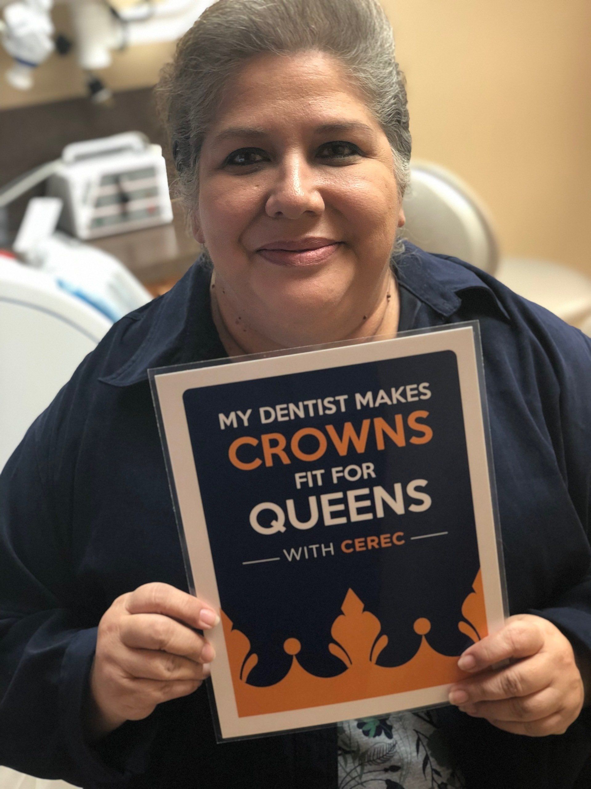 A woman holding a sign that says 