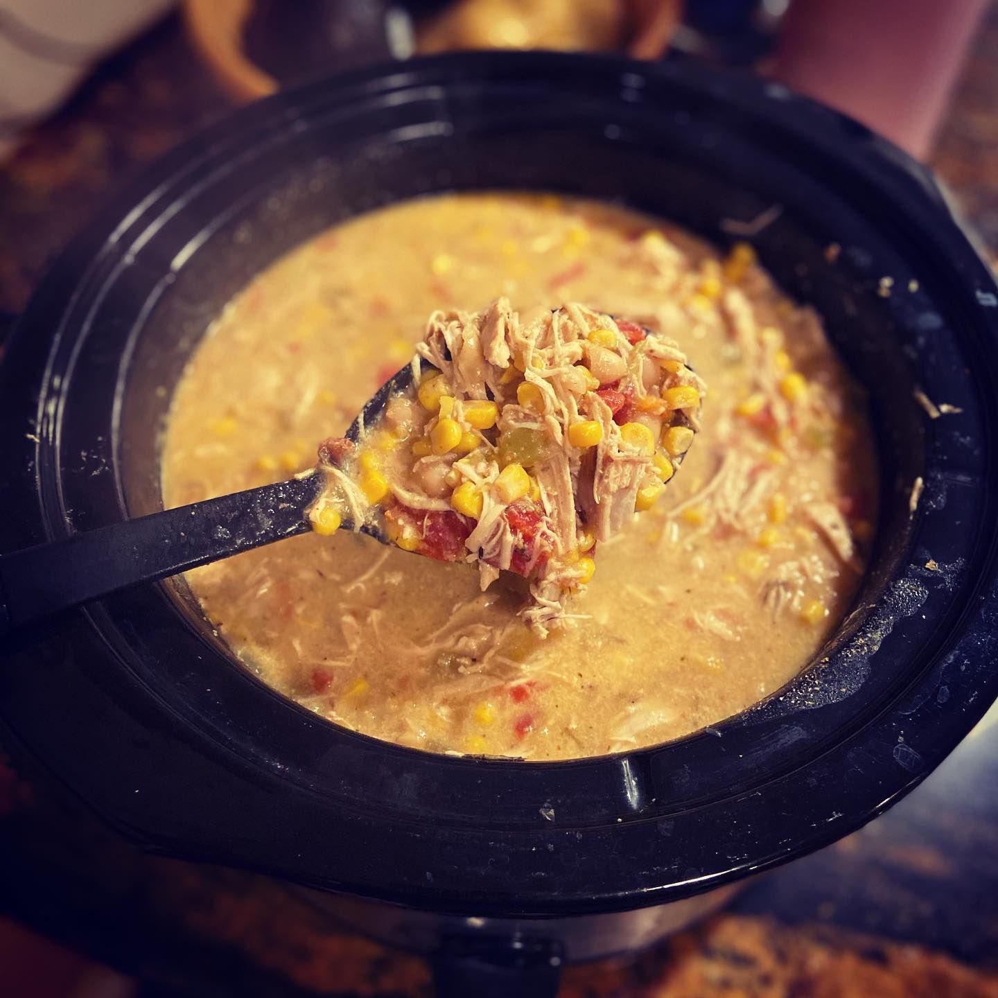 A bowl of soup with a spoon in it