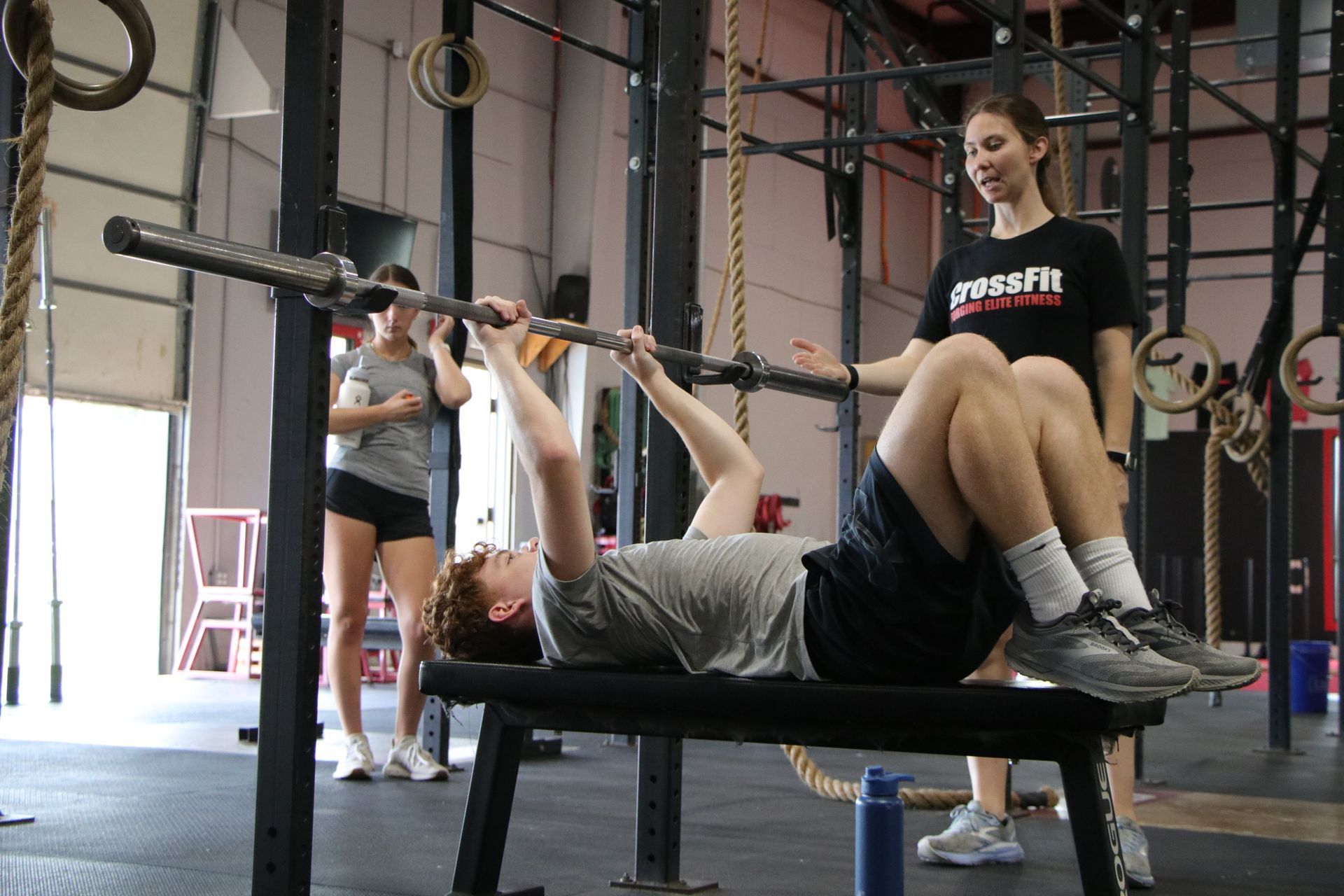 A group of children are posing for a picture in a gym.