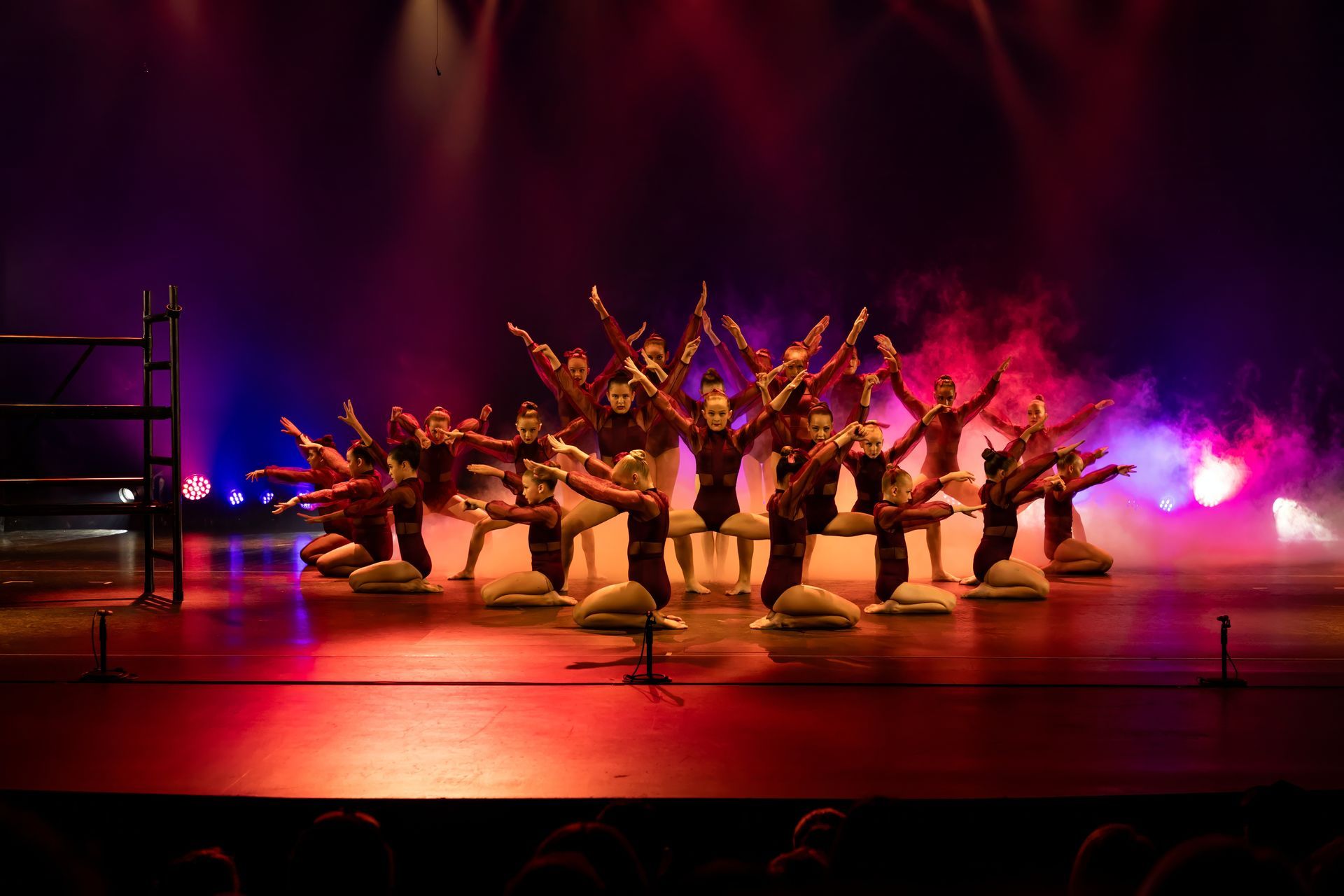 A Group Of Cheerleaders Are Posing For A Picture On A Field — Dance Express Mackay In North Mackay, QLD