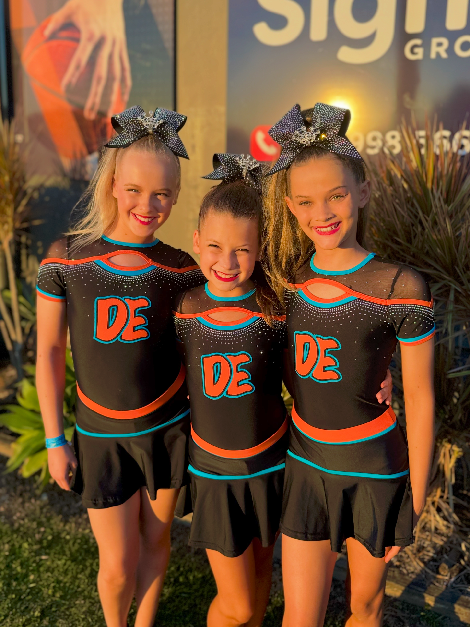 A Group Of Young Girls Are Posing For A Picture In A Dressing Room — Dance Express Mackay In North Mackay, QLD