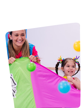 Children and a Teacher Dancing With a Colorful Parachute — Dance Express Mackay In North Mackay, QLD 