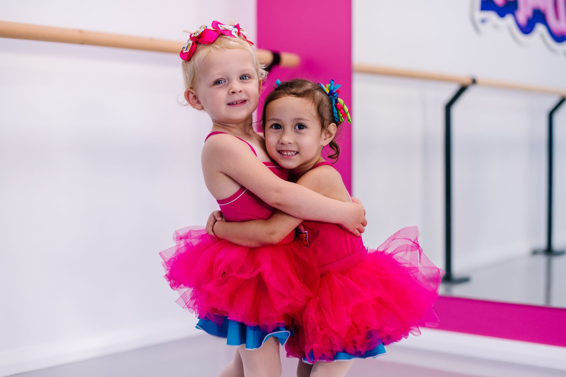 A Group Of Young Girls Are Posing For A Picture In A Dressing Room — Dance Express Mackay In North Mackay, QLD