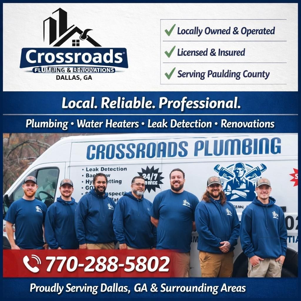 A man standing in front of a crossroads plumbing van