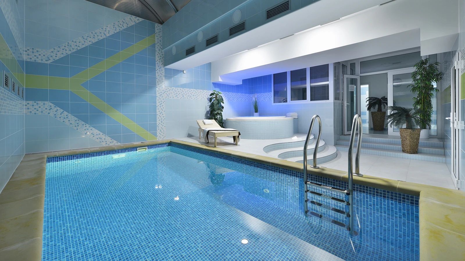 A restaurant with tables and chairs and a bar.