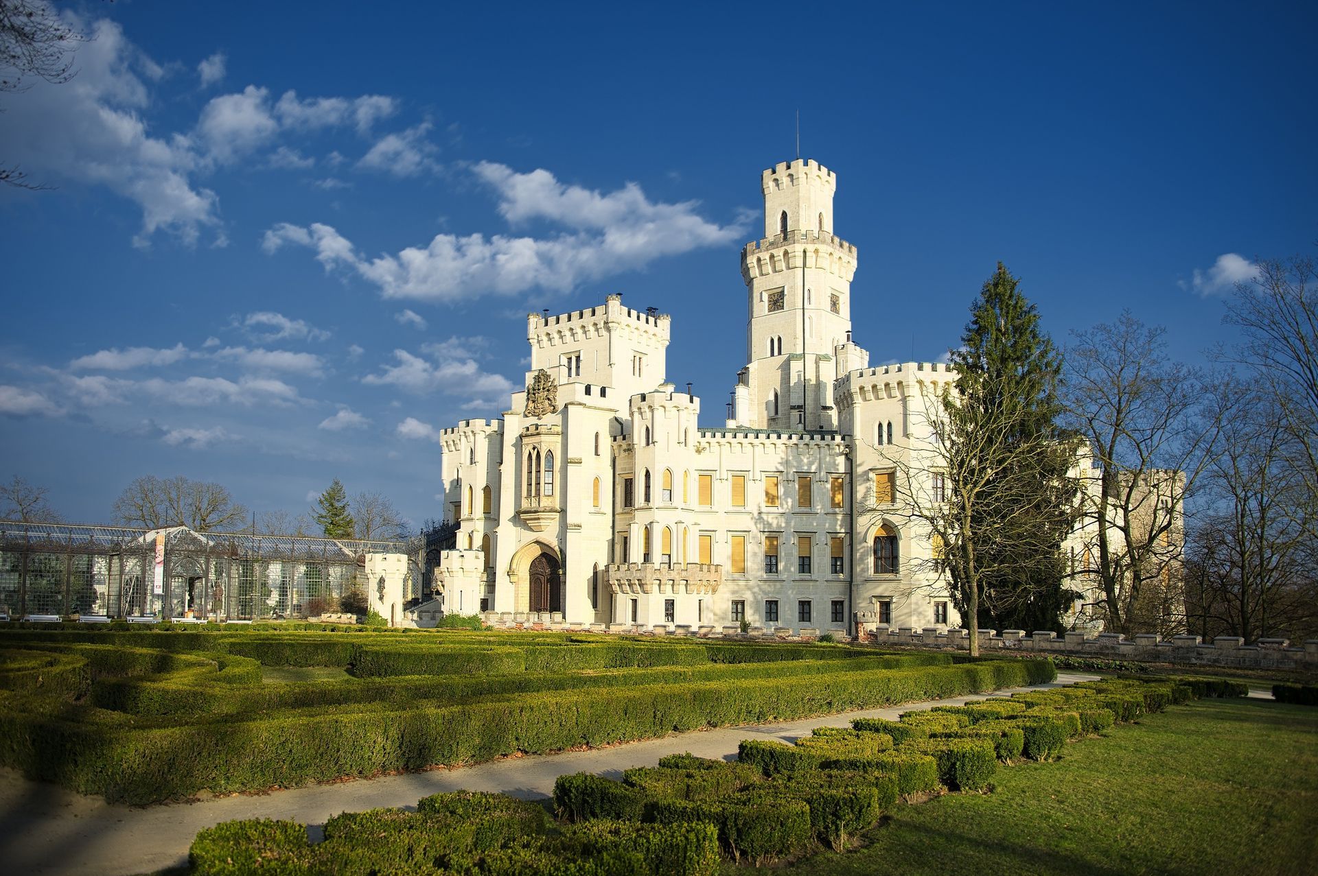 A clock tower in the middle of a city with a clock on the side of a building.