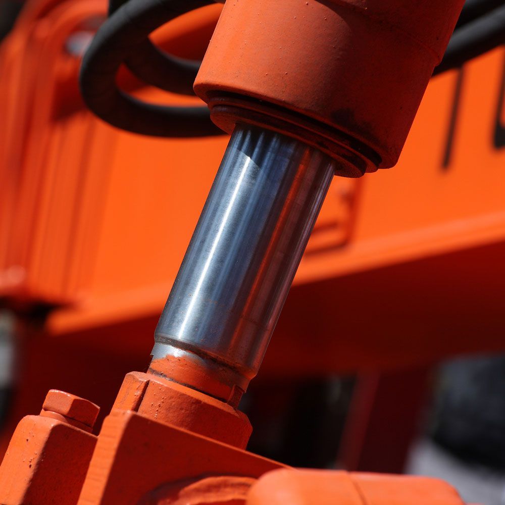 Orange Hydraulic Cylinders — South Fork, PA — Reighard Machine Inc.