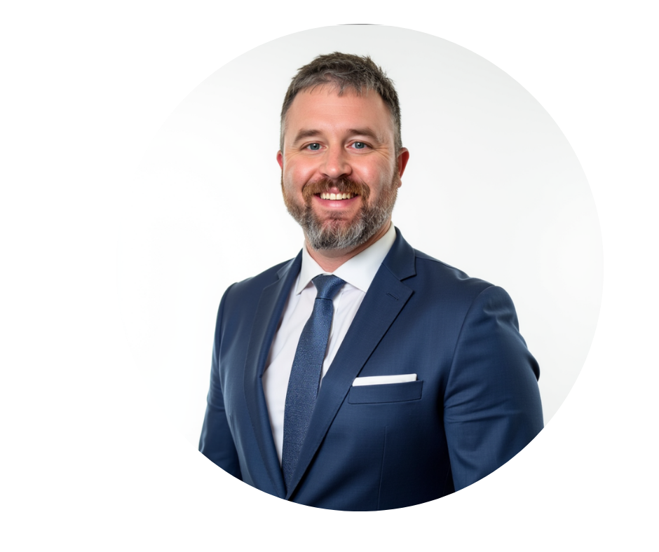 Man in a suit smiling, posed in a white circle.