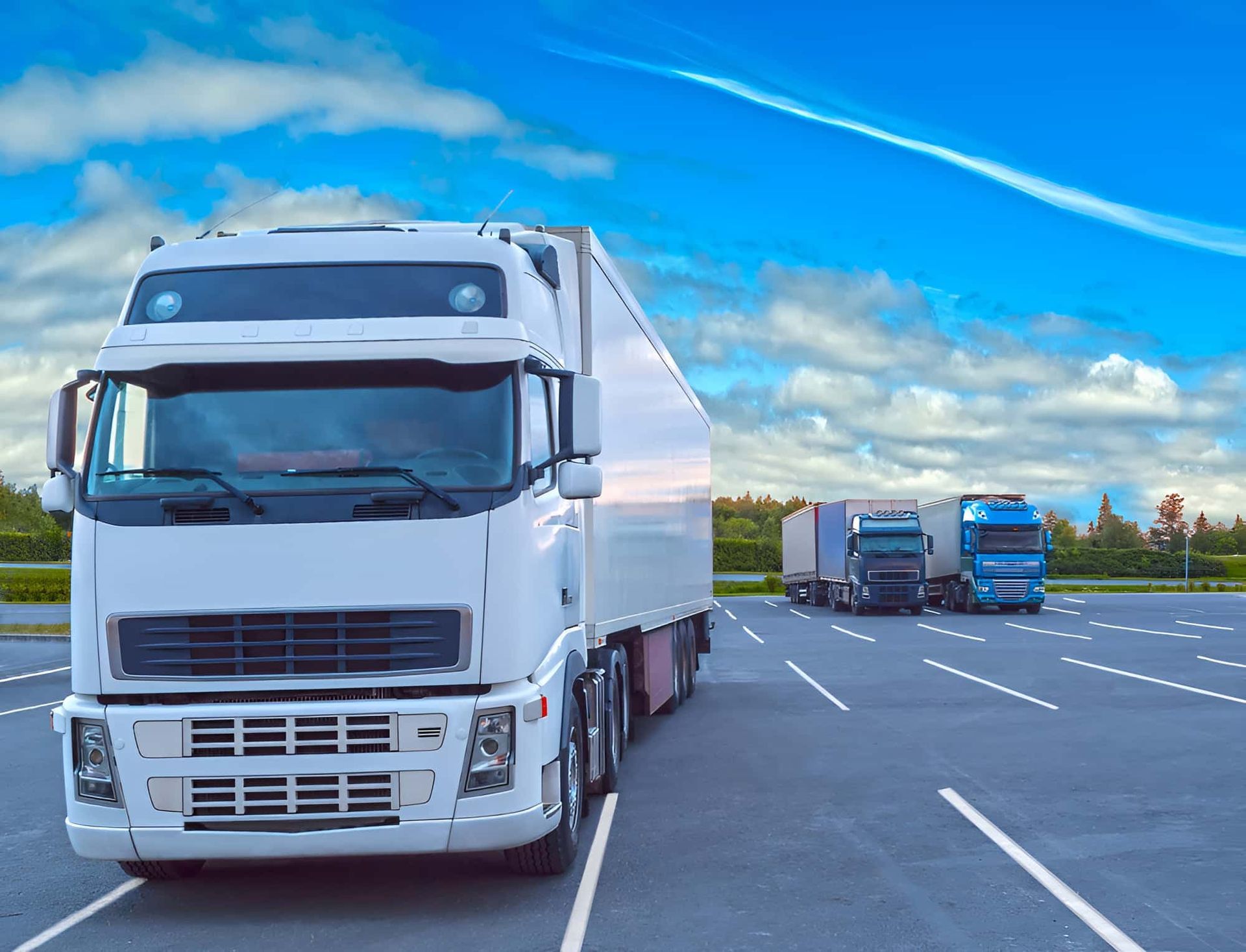 A Row Of Semi Trucks Are Parked — Central Desert Transport In Ciccone, NT