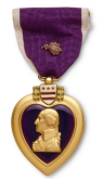 Purple Heart medal with bust of George Washington, purple ribbon, and gold trim.