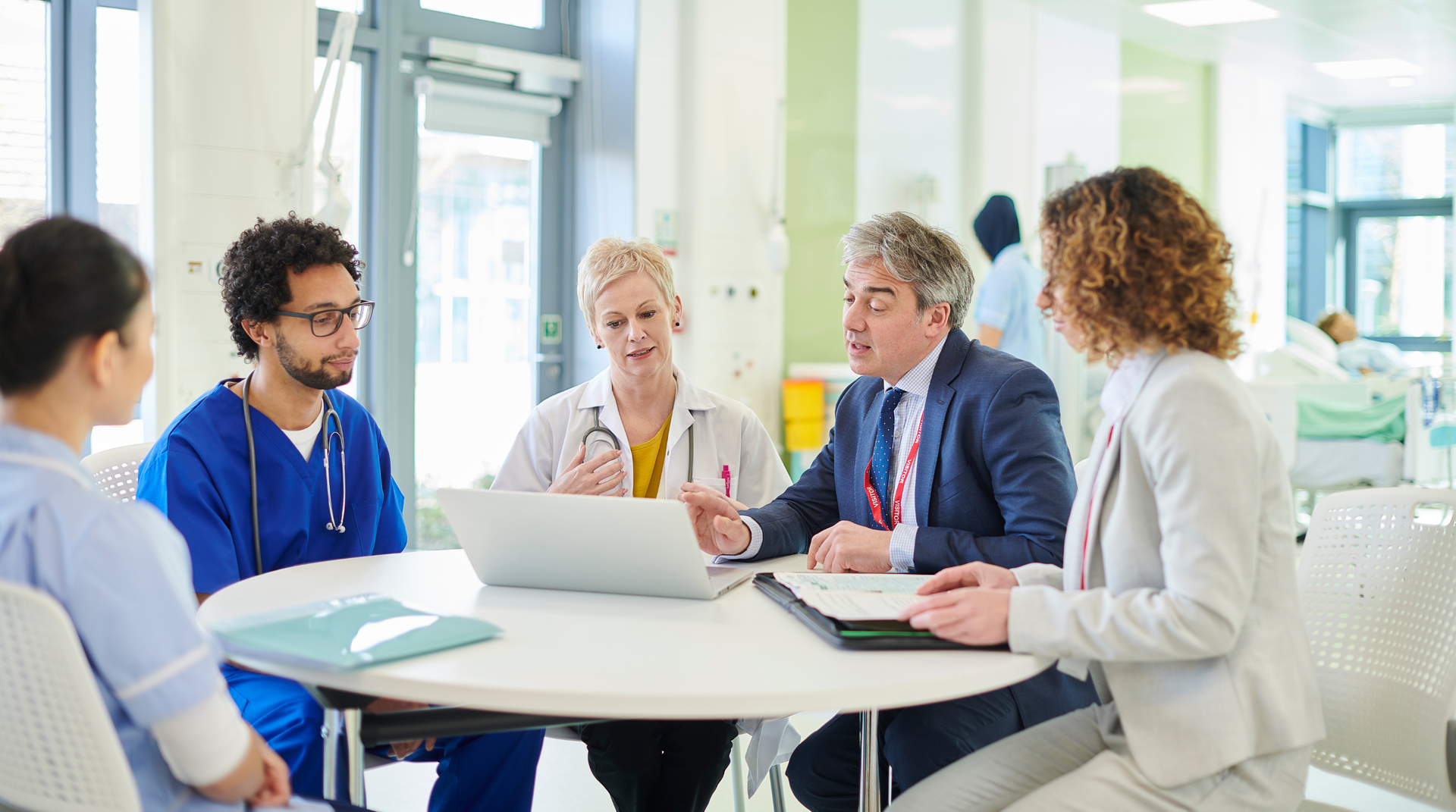 Healthcare leadership and clinical team reviewing technology operating model