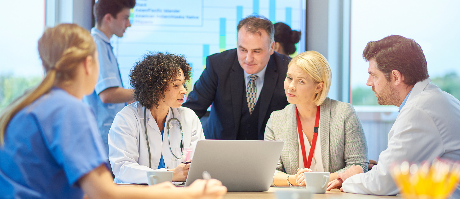 Healthcare leaders reviewing technology decisions
