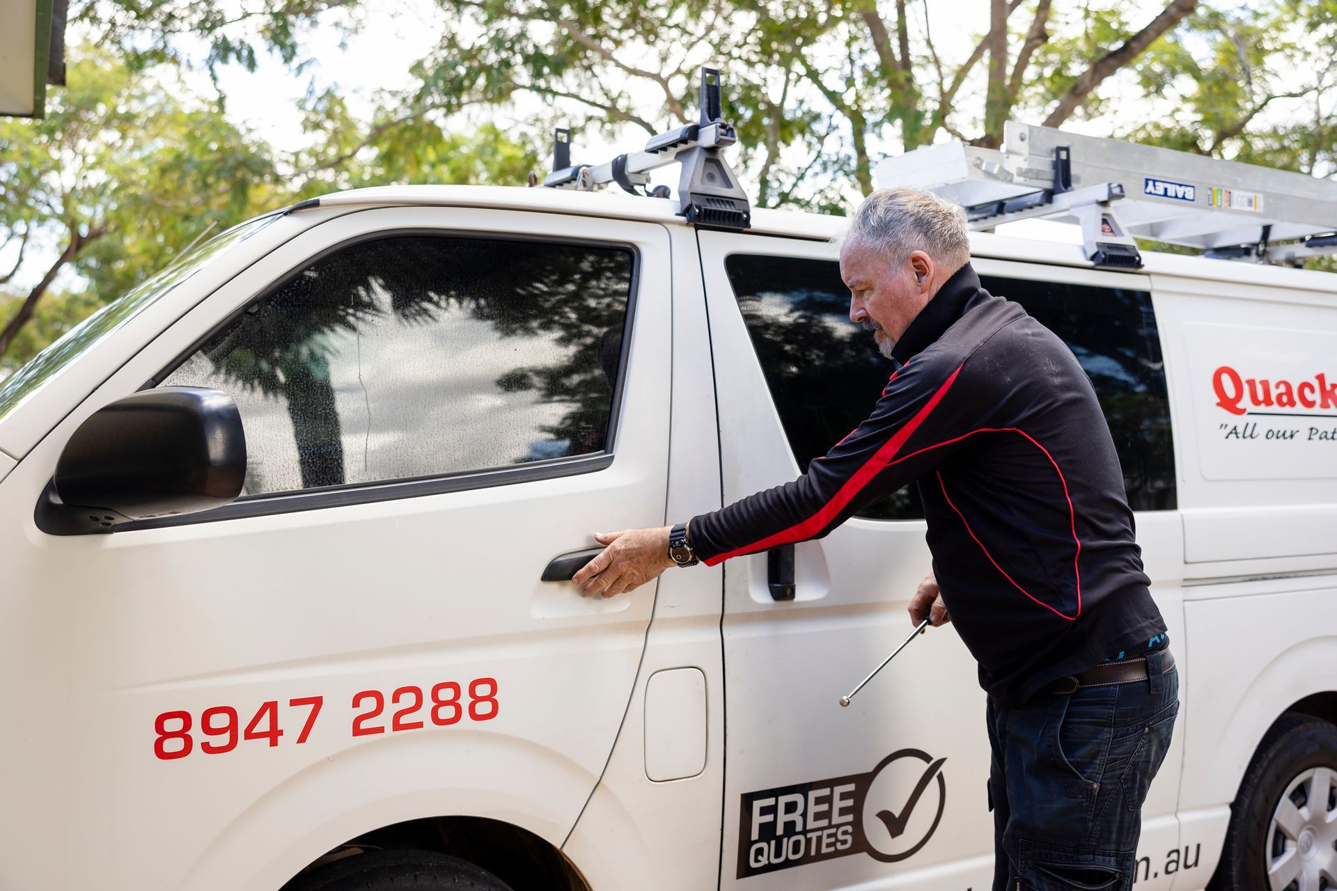 A Man Getting Into His Work Van — Quack Pest Control in Winnellie, NT