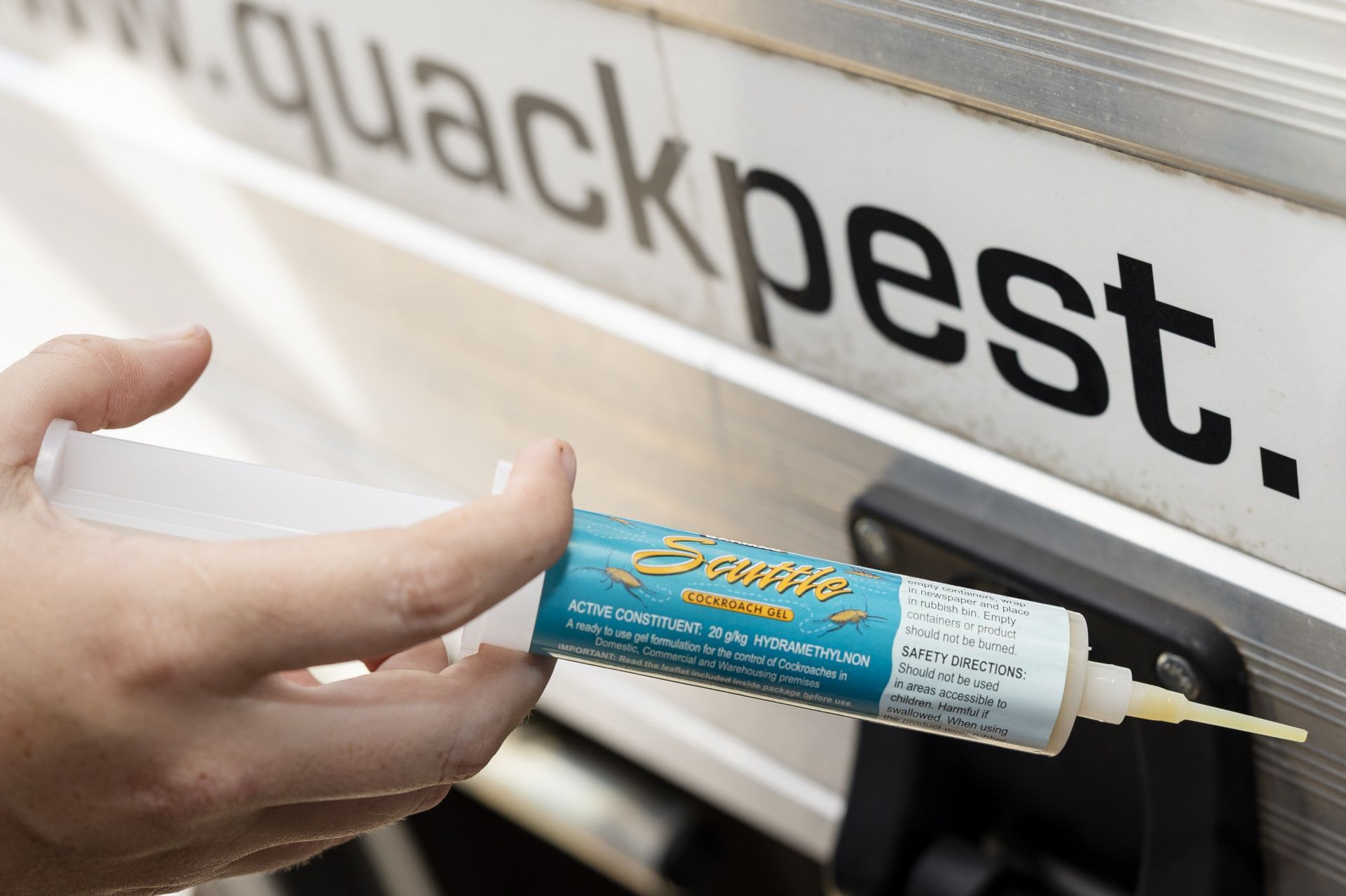 Pest Bait Being Stacked On Skewer— Quack Pest Control in Winnellie, NT