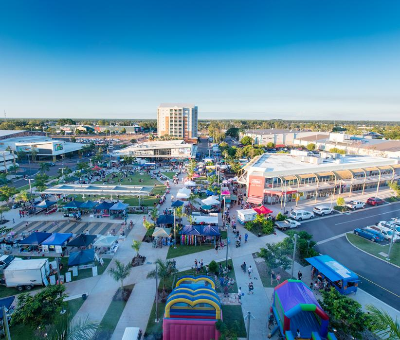 An Aerial View of A City with A Lot of People and Buildings — Quack Pest Control in Palmerston, NT