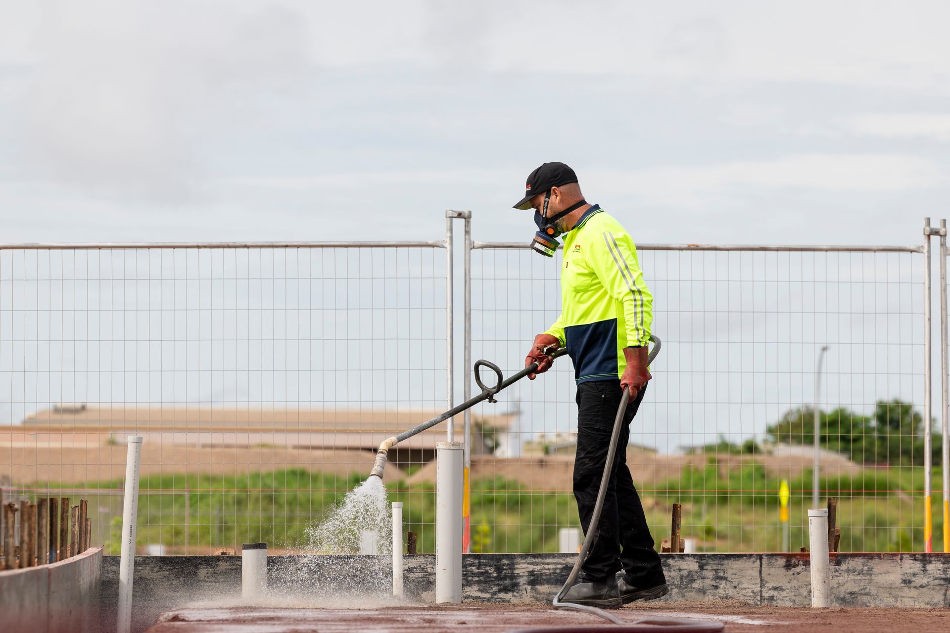 Worker Using A Hose For Pest Control