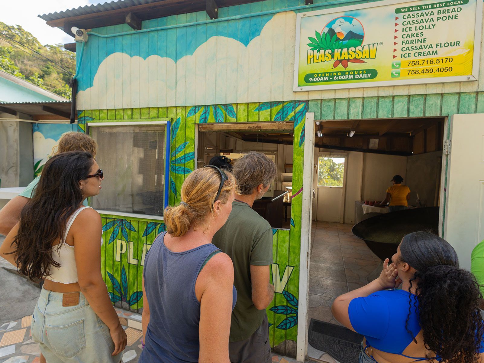 A group of people are standing in front of a restaurant with a sign that says play