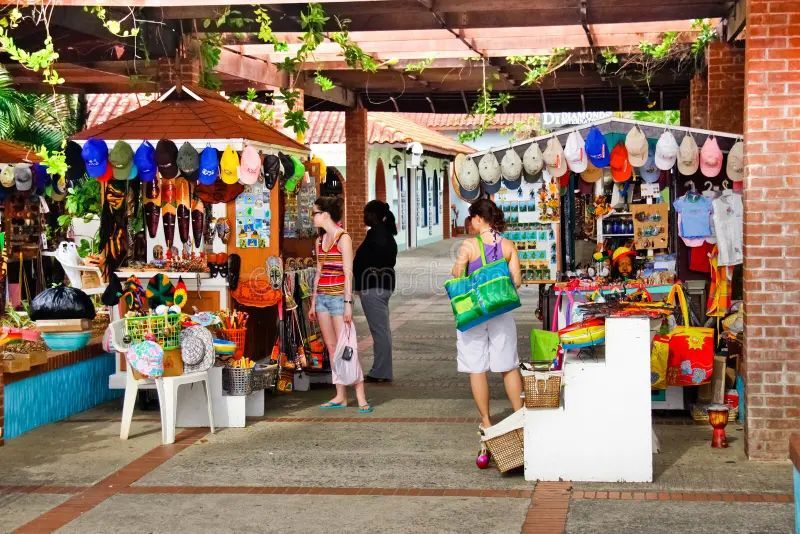 A group of people are shopping at a market.