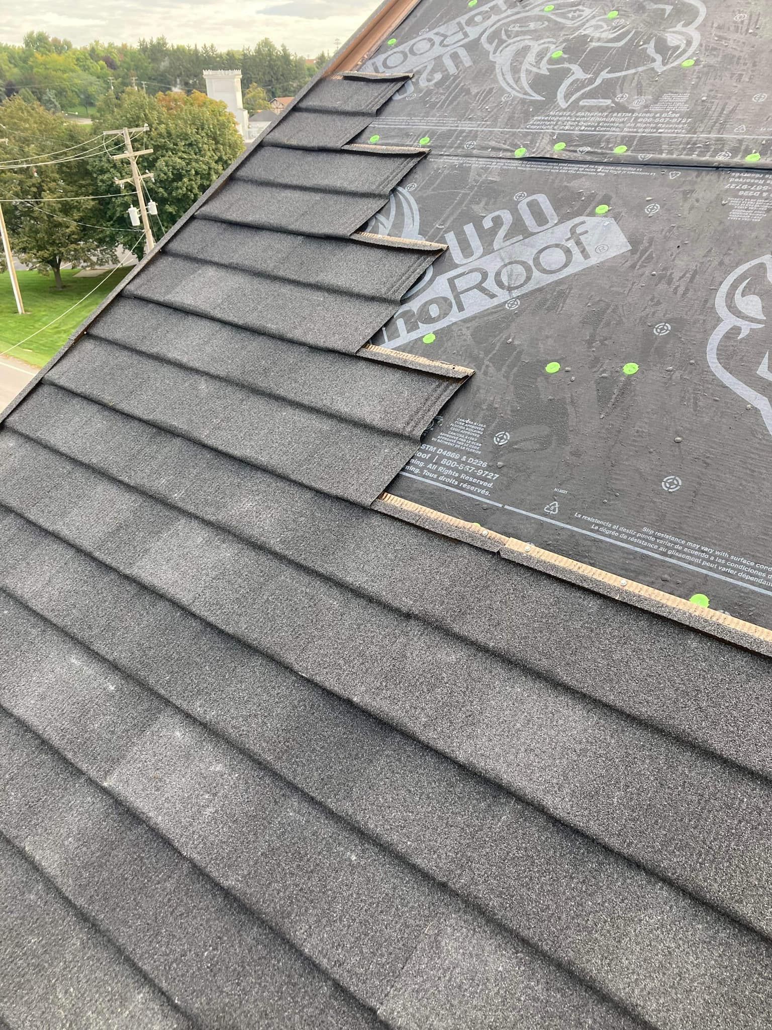 A close up of a roof with shingles on it.