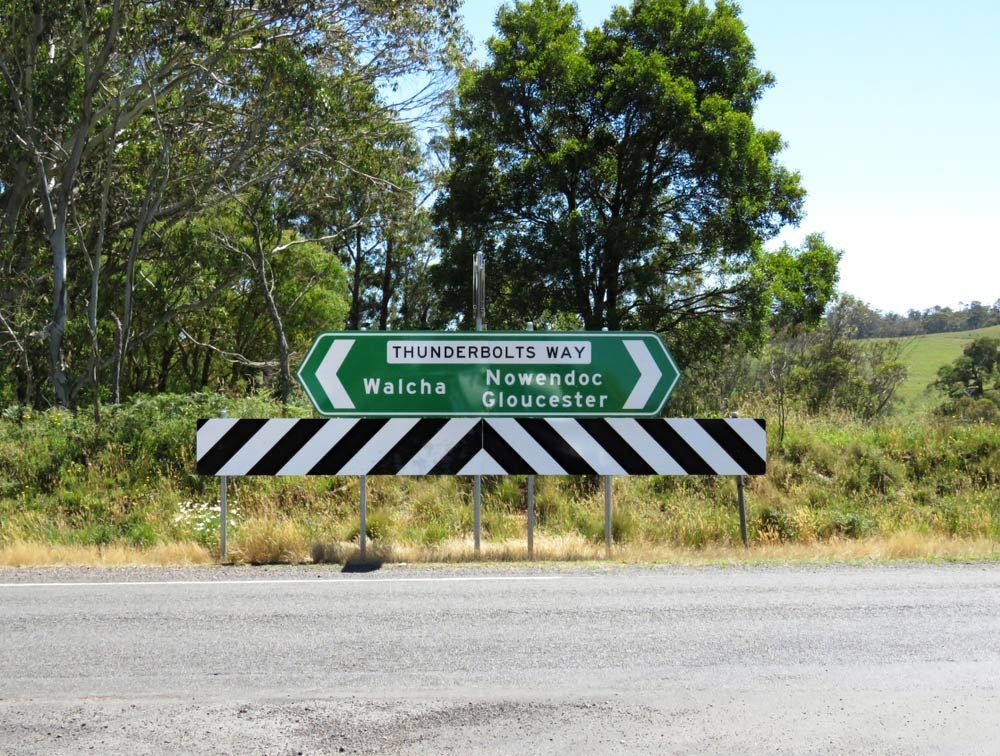 Sign On The Thunderbolts Way Pointing To Walcha, Nowendoc And Gloucester — Glass Repairs & Installations in Walcha, NSW