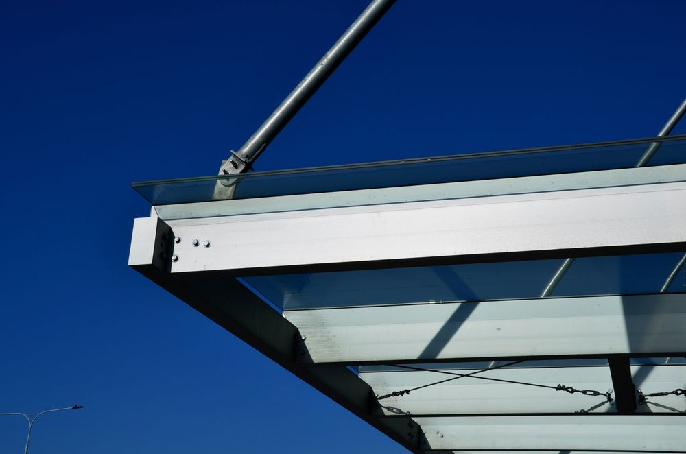 Aluminum Construction Windows Above The Pergola And Strut Window — Glass Repairs & Installations in Taminda, NSW