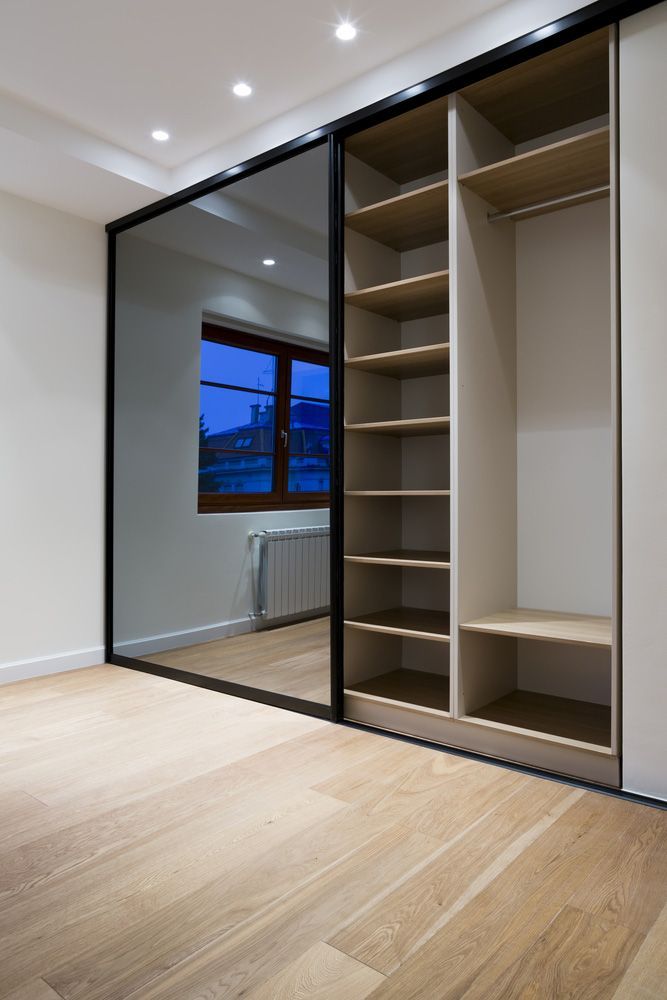 Wardrobe Furniture In Bedroom Interior — Glass Repairs & Installations in Taminda, NSW
