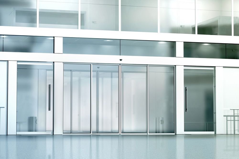 Blank Commercial Building With Windows And Doors — Glass Repairs & Installations in Gunnedah, NSW