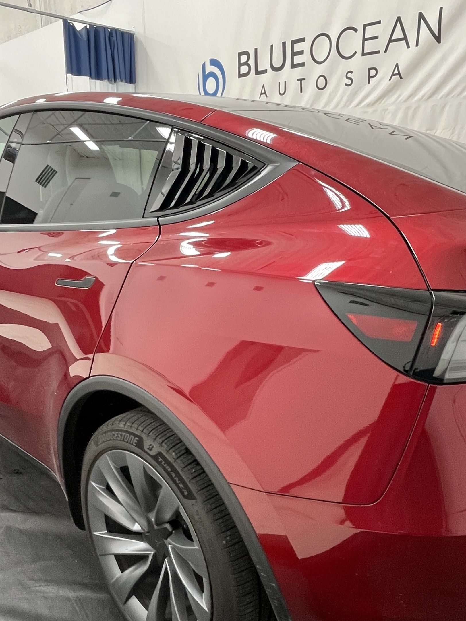 Road film layered on the paint after the long roadtrip in the Tesla Model Y
