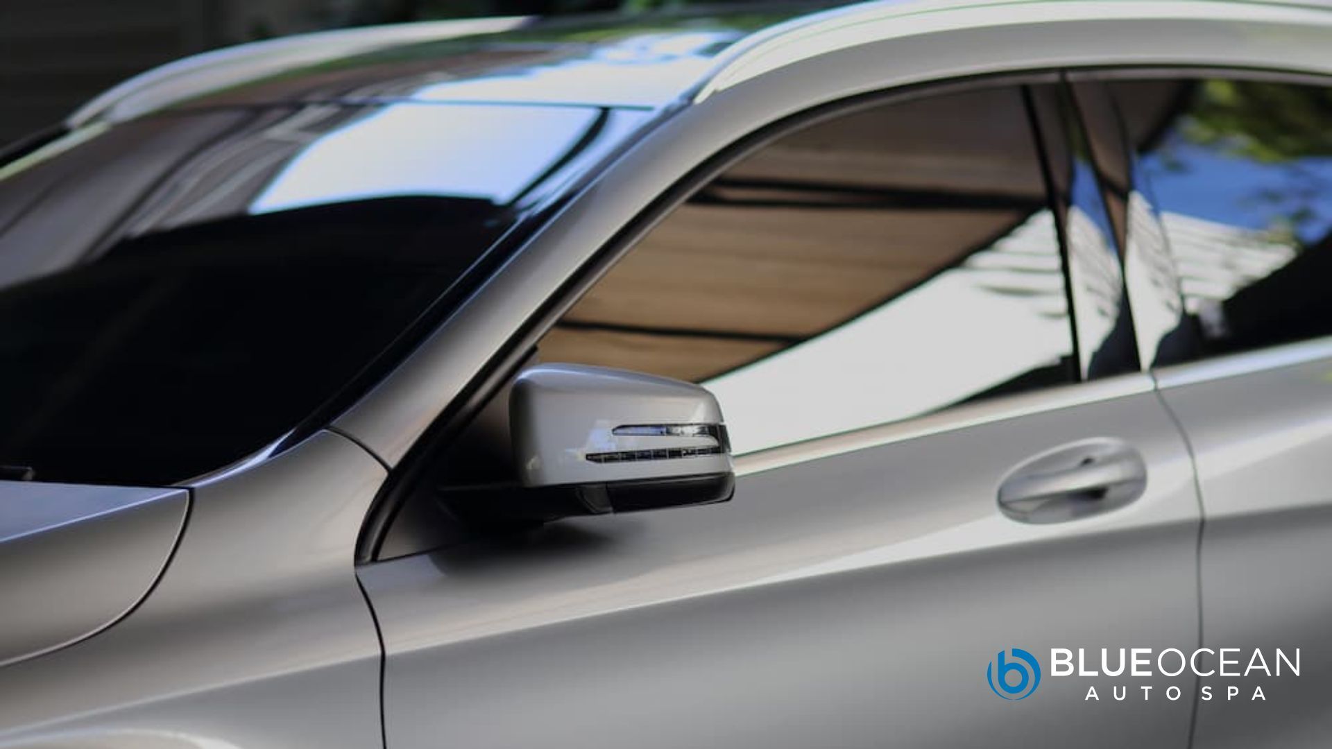 luxury car with dark window tint installed for heat and glare reduction