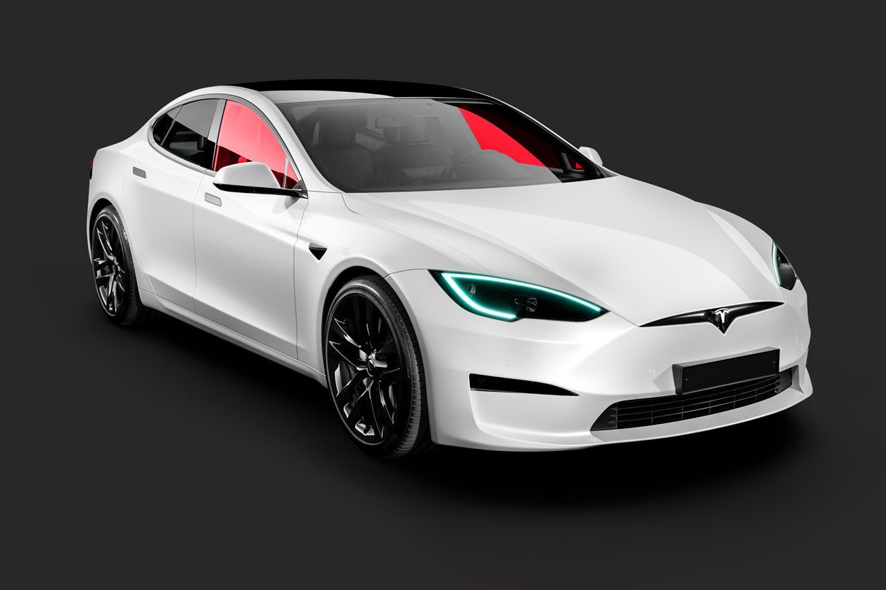 A white tesla model s with blue headlights on a black background.