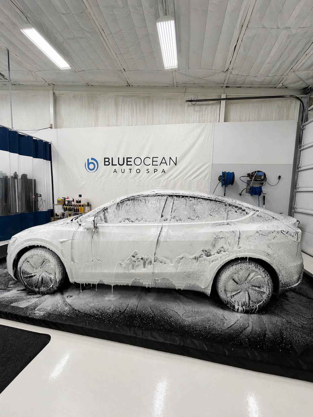 Thick foam wash during the detailing process on this Tesla Model Y. Proper prep is critical before ceramic coating to ensure maximum bonding and long-term durability.
