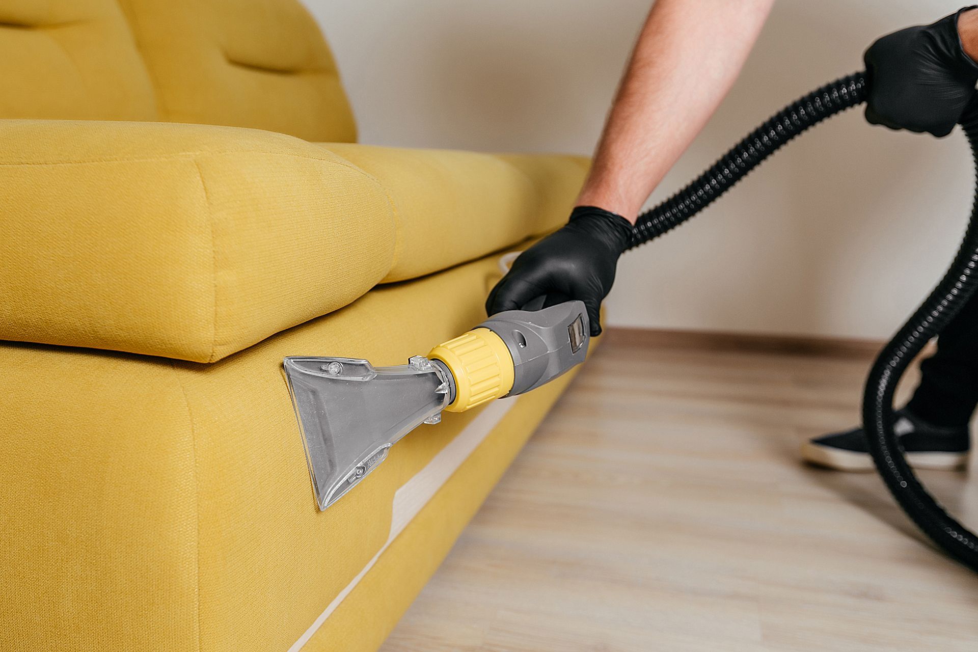 vacuuming a couch