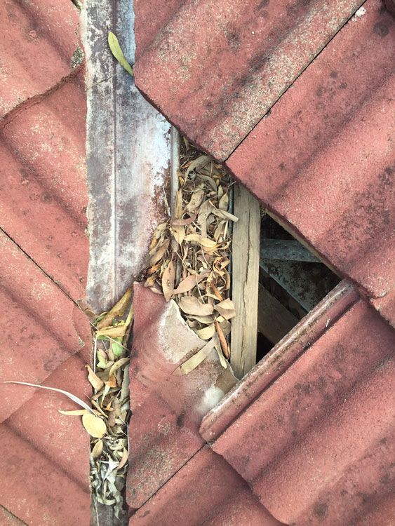 A Close Up of a Roof With a Hole in It — Mr Roof Tiles in Kingscliff, NSW