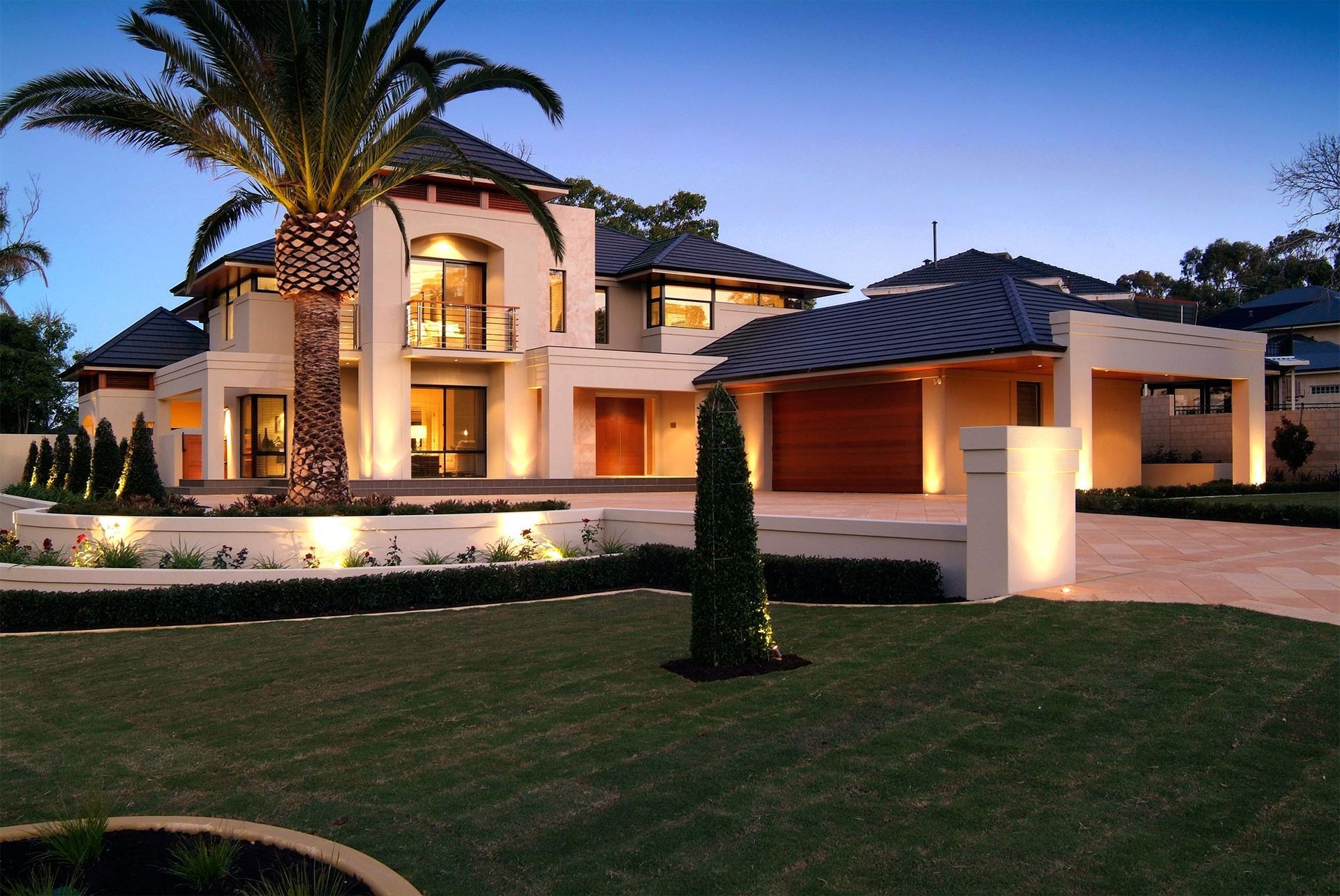 A Large House With a Palm Tree in Front of It — Mr Roof Tiles in Murwillumbah, NSW