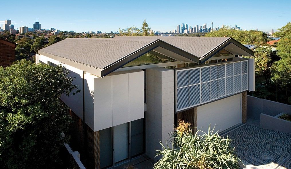 An Aerial View of a House With a City in the Background — Mr Roof Tiles in Tweed Heads, NSW