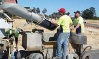 Men pouring concrete for retaining walls in WA