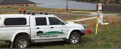 A Man Is Using A Level On A Tripod On A Construction Site – Warrnambool, VIC - Joseph Land Surveying