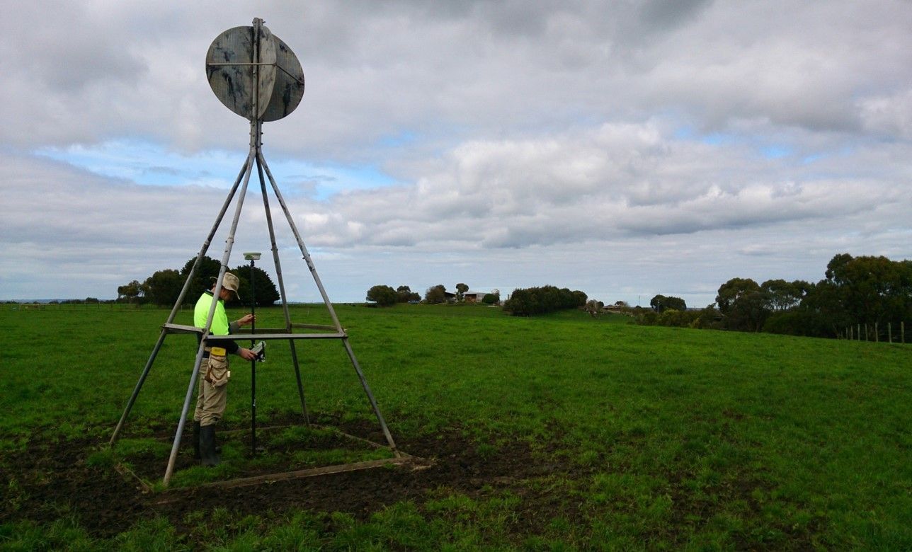 A Laser Level Is Sitting On Top Of A Tripod In A Dirt Field – Warrnambool, VIC - Joseph Land Surveying